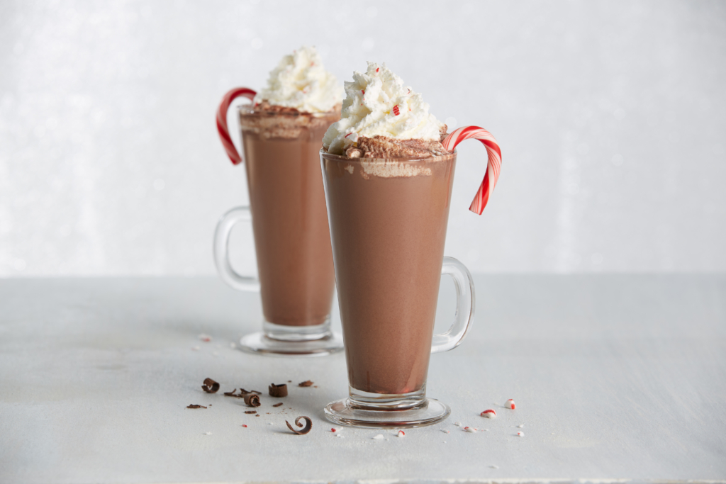 Candy Cane Bittersweet hot Cocoa on a white table.