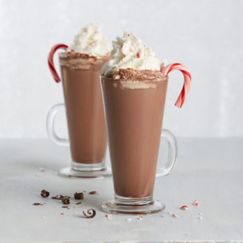 Candy Cane Bittersweet hot Cocoa on a white table.