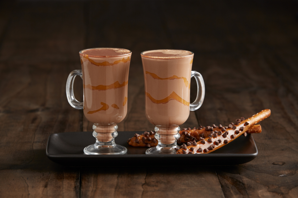 Image of two glass of caramel hazelnut mochas on a tray.