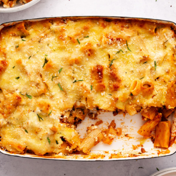 Image of a cheesy pasta bake in a pan.