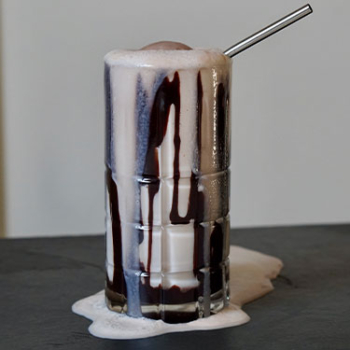 Image of a chocolate soda in a glass.