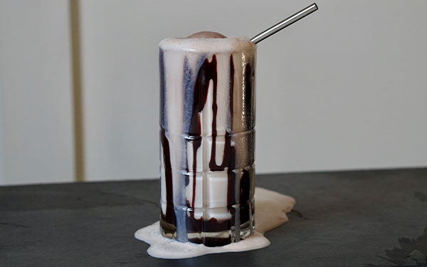 Image of a chocolate soda in a glass.