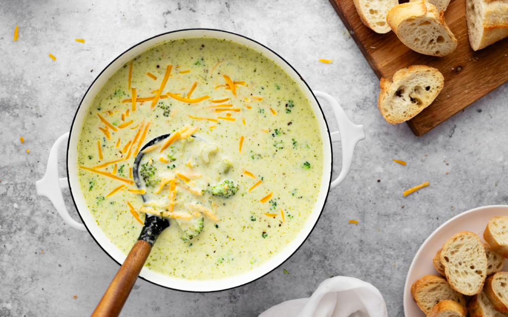 Image of creamy broccoli cheddar soup in a pot.