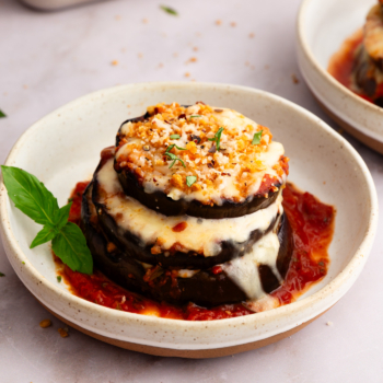 Image of an eggplant parmesan stack on a plate.