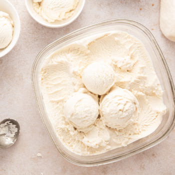 Image of a container of creamy, frozen custard ready to be scooped into bowls.