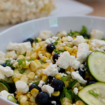Image of grilled summer cord blueberry and zucchini salad in a bowl.