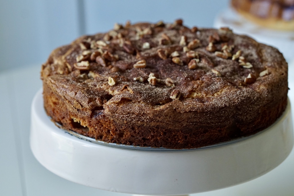 Image of Hanukkah apple cake on a cake stand.